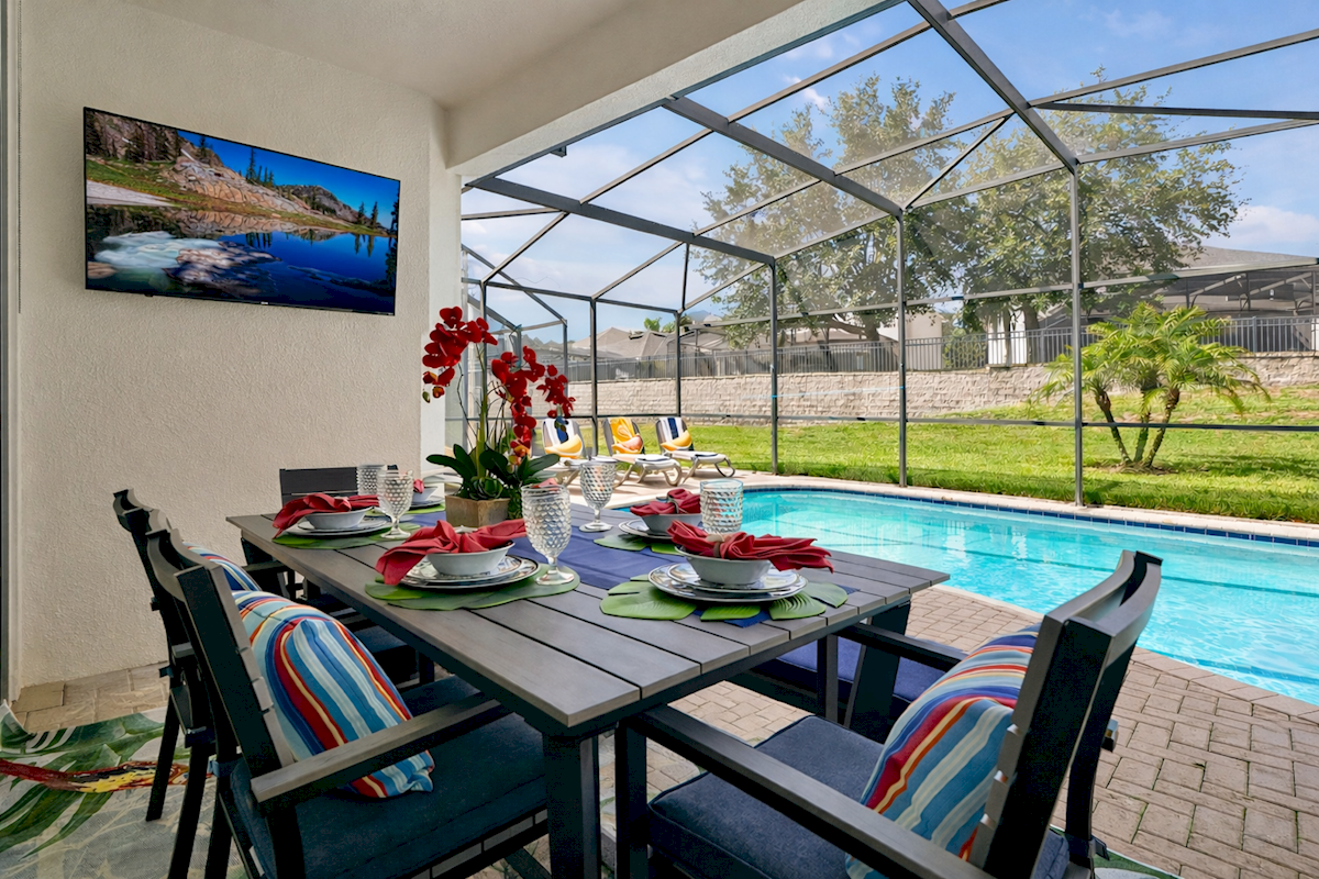 Poolside dining & TV lounge — your perfect Florida retreat.
